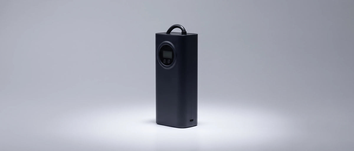 InflatoPro standing beside a car wheel